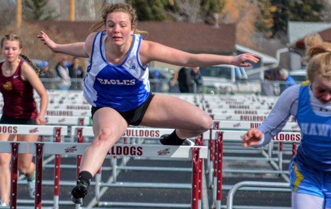 Cheyenne Maddox runs in the 100 meter hurdles.